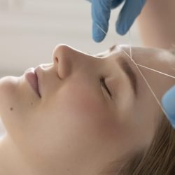 close-up-young-woman-getting-eyebrow-treatment